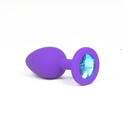 Силиконовая анальная пробка c голубым камнем  S фиолетовая