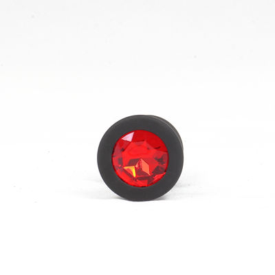 Силиконовая анальная пробка черная L  с красным камушком RY-069