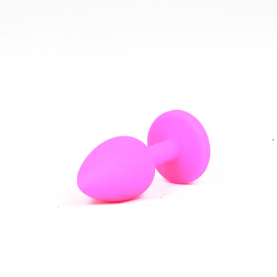 Силиконовая анальная пробка c фиолетовым камнем  S розовая