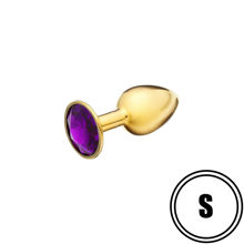 Золотистая анальная пробка с пурпурным камушком S